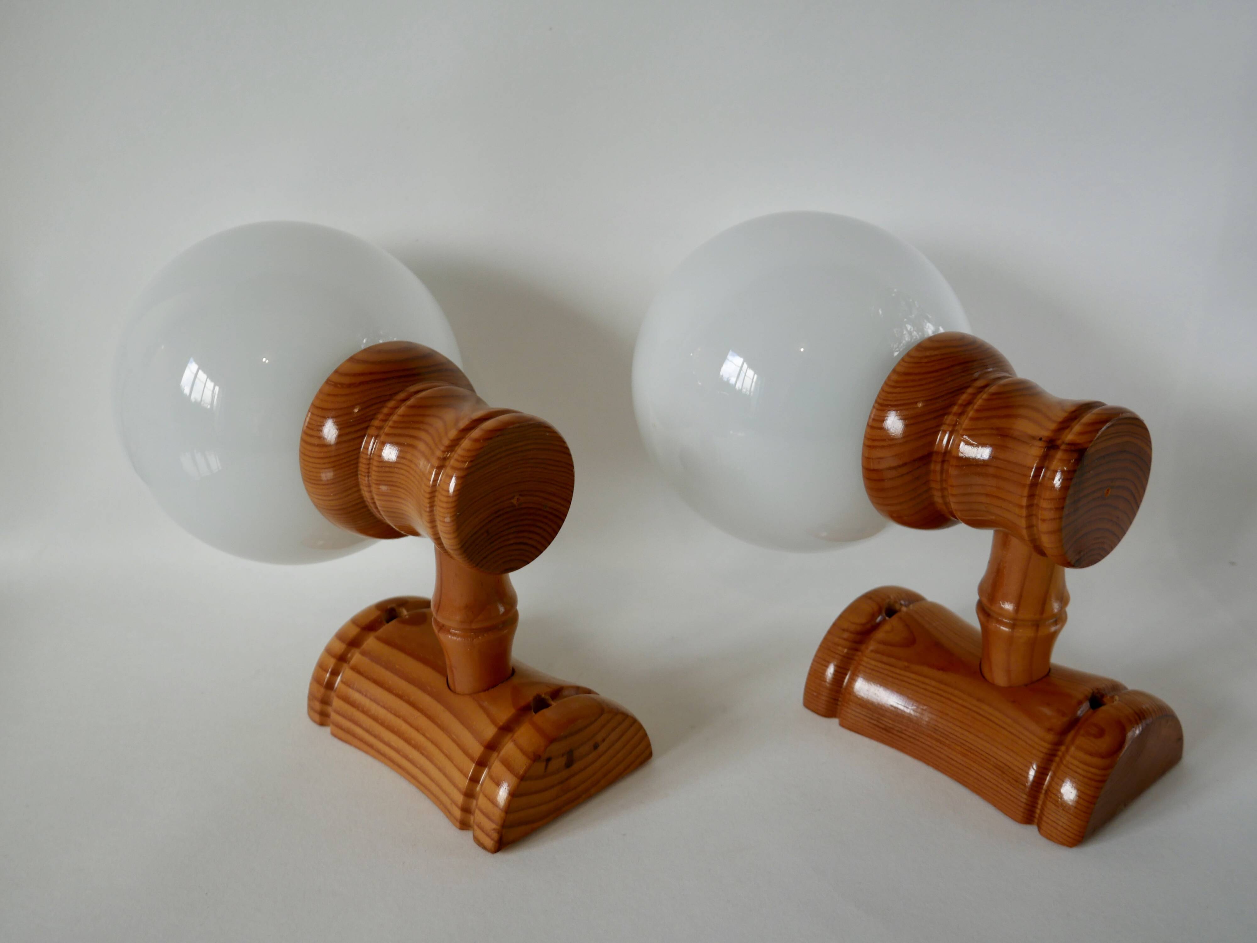 Pair of globe wall lights in pine and opaline from the 60s