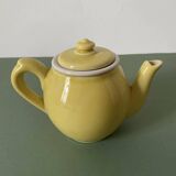 Small lemon yellow porcelain teapot with filter