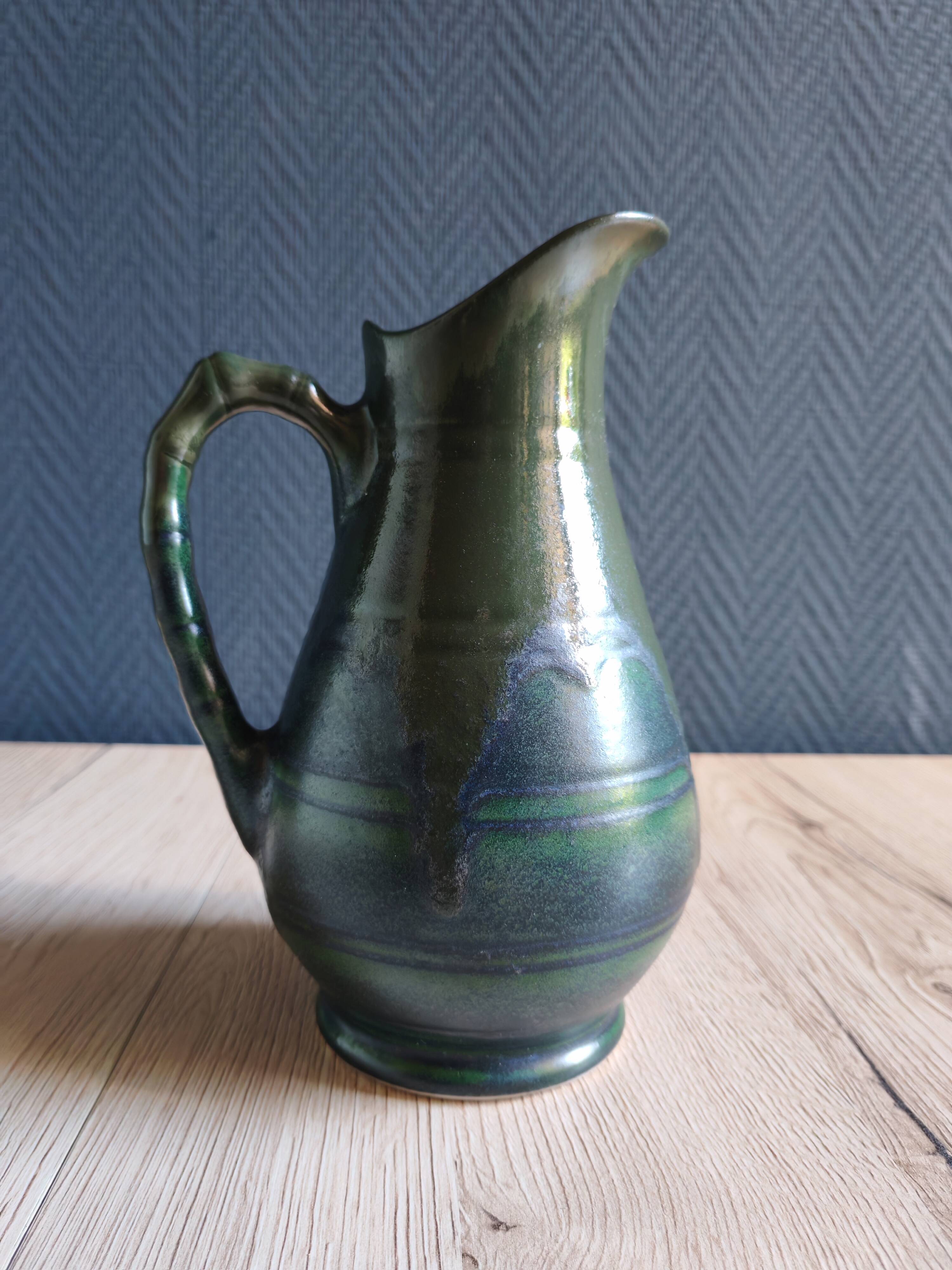 Vintage ceramic pitcher vase in glazed green and blue.