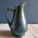 Vintage ceramic pitcher vase in glazed green and blue.
