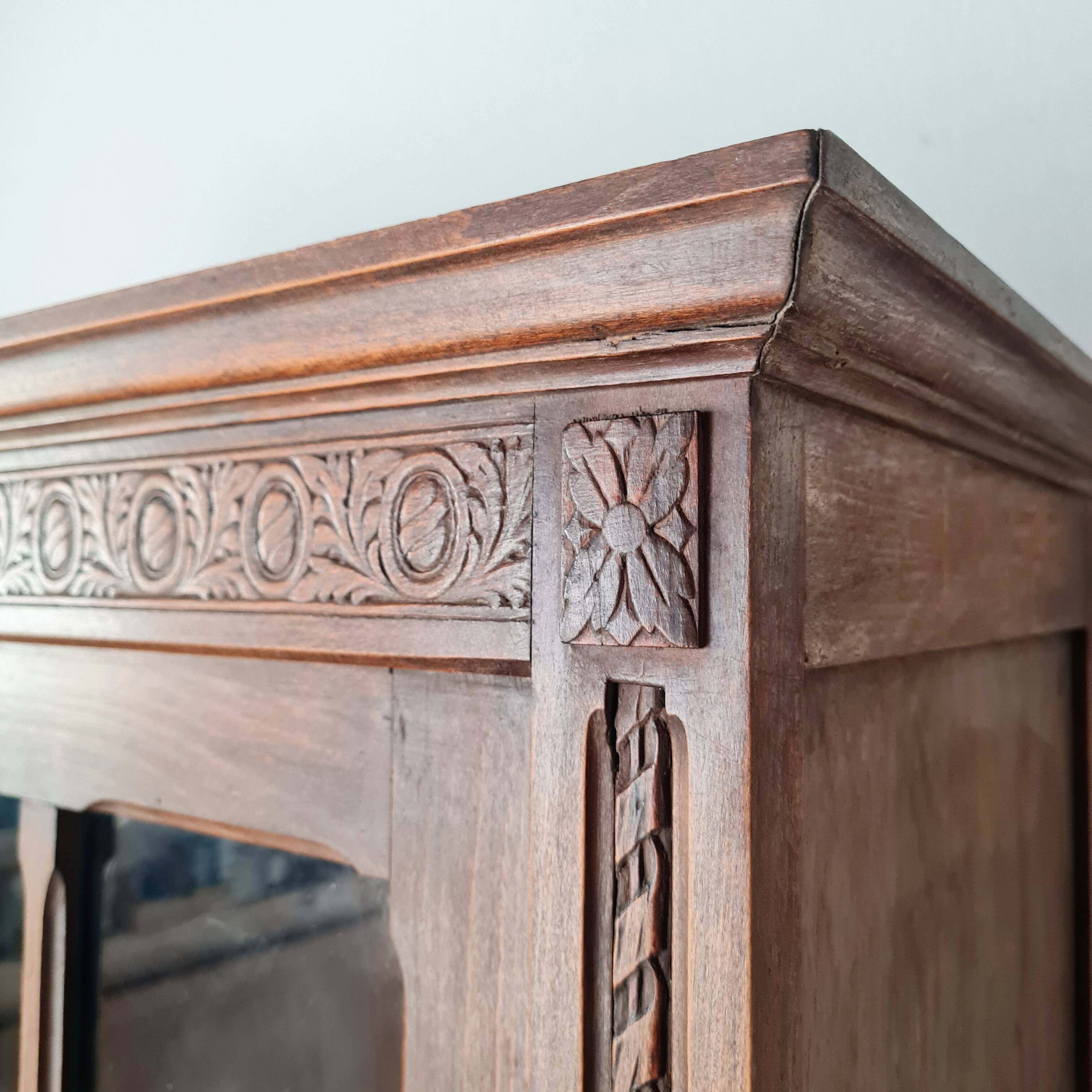 Old glass-fronted library in solid wood