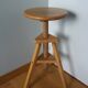 Tripod stool with a screw.