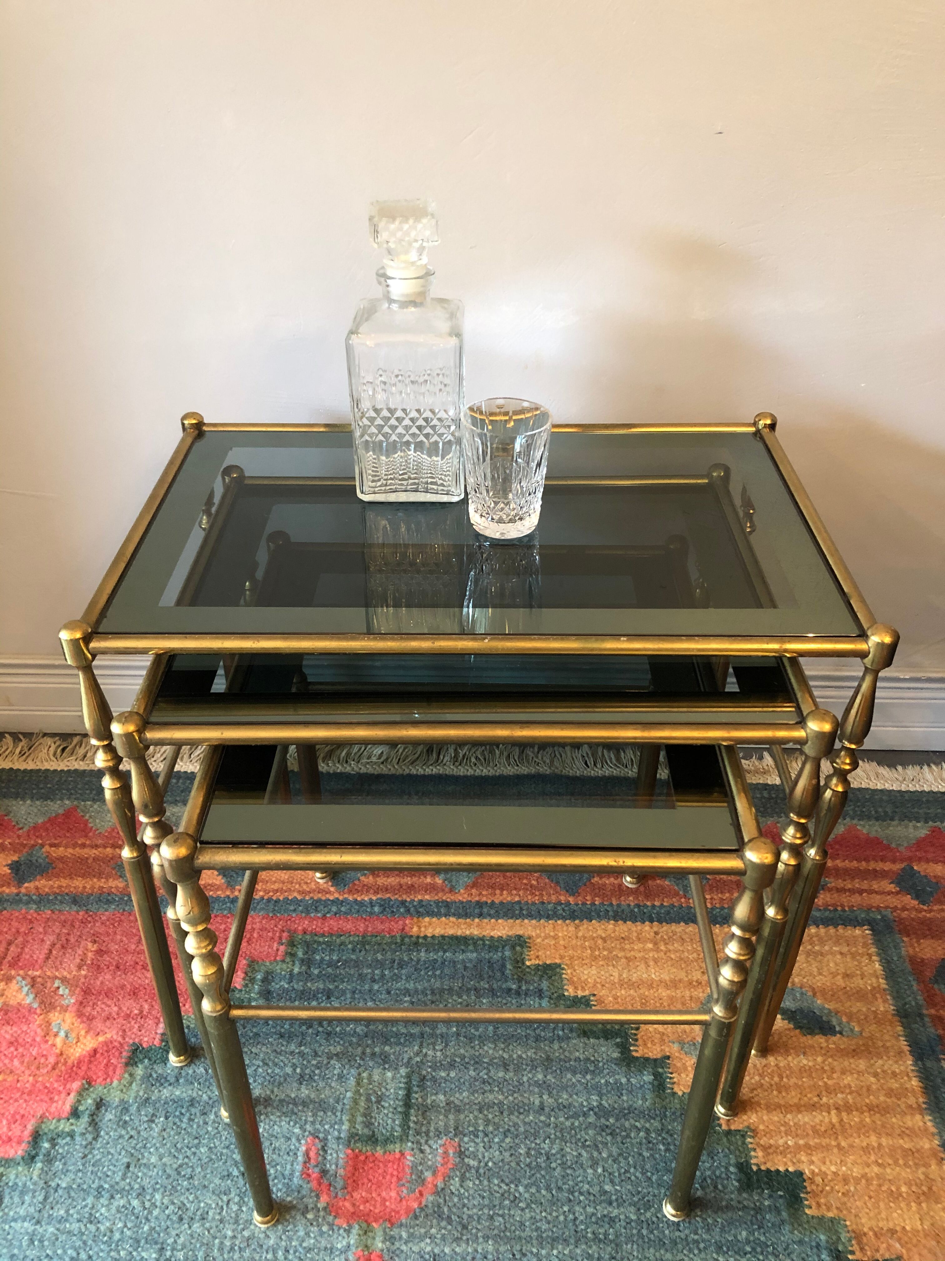 Brass tables and smoked glasses
