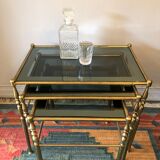 Brass tables and smoked glasses