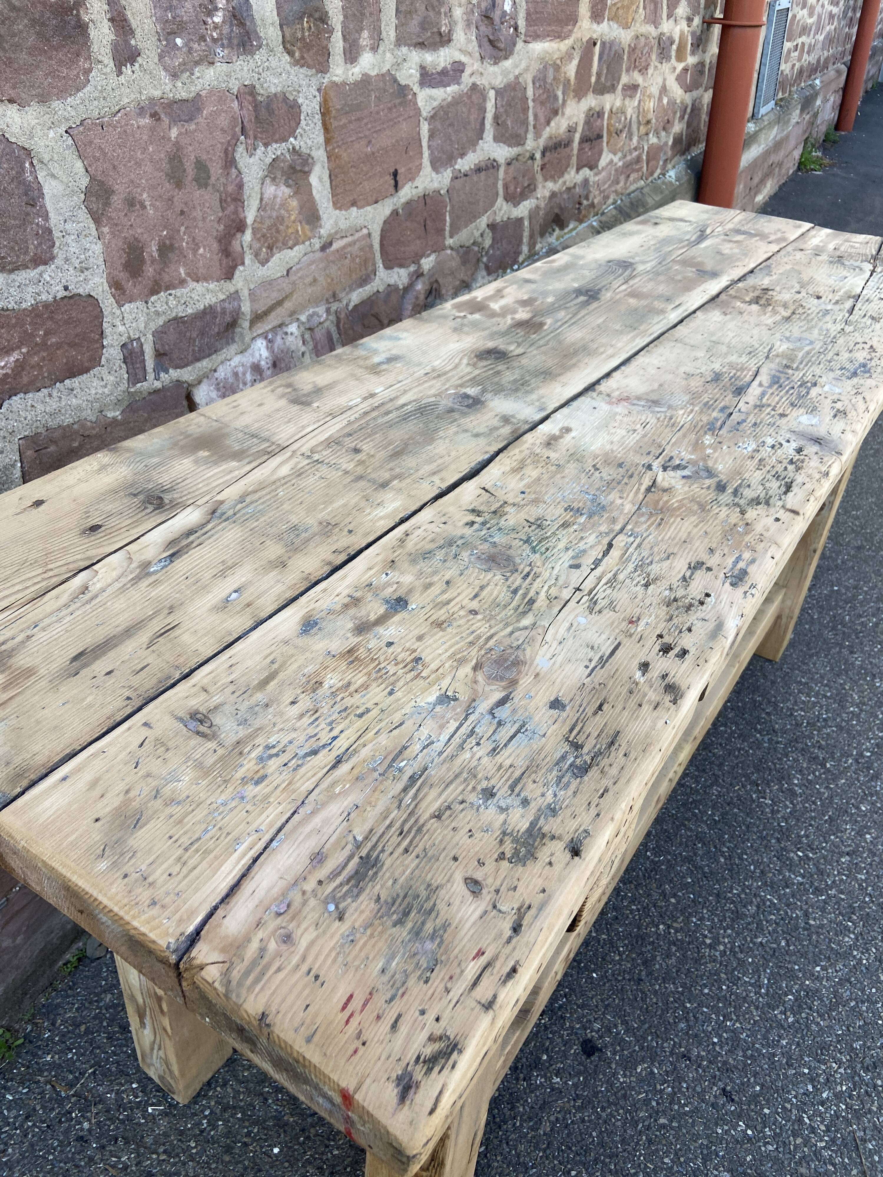Primitive industrial table workbench in raw natural wood vintage bohemian trade store