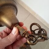 Rustic old wooden and brass suspension.