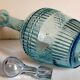 Blue glass carafe with vintage pegs