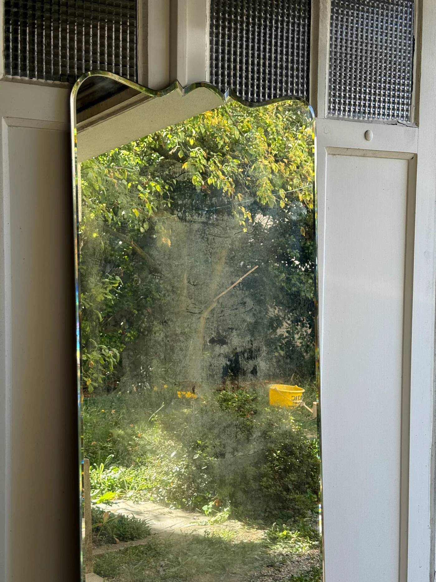 Large vintage mirror with bevelled glass.
