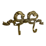 Two-hook coat rack with knot and ribbon in brass