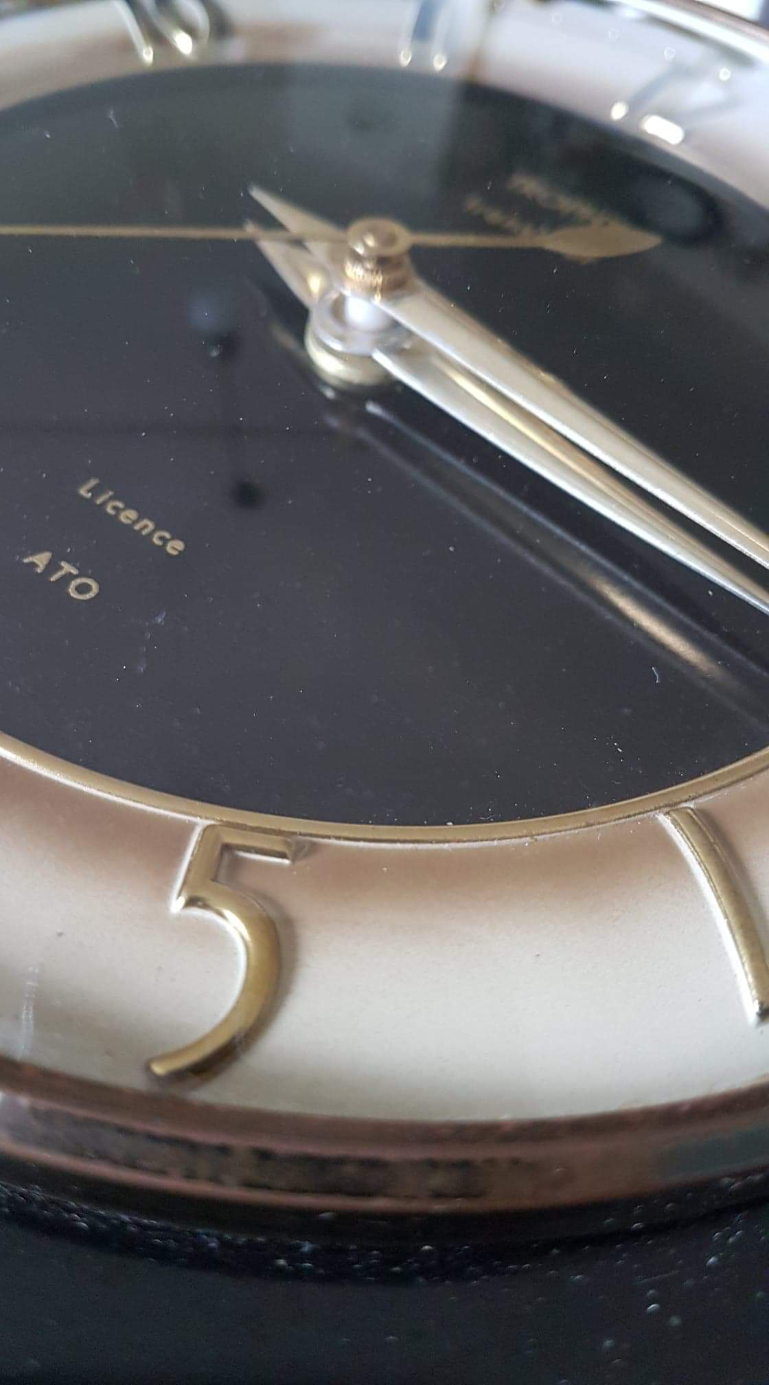 Black and gold formica wall pendulum mark Trophy Transistor