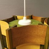 Older lamp in wood veneer, partially painted in green colour.