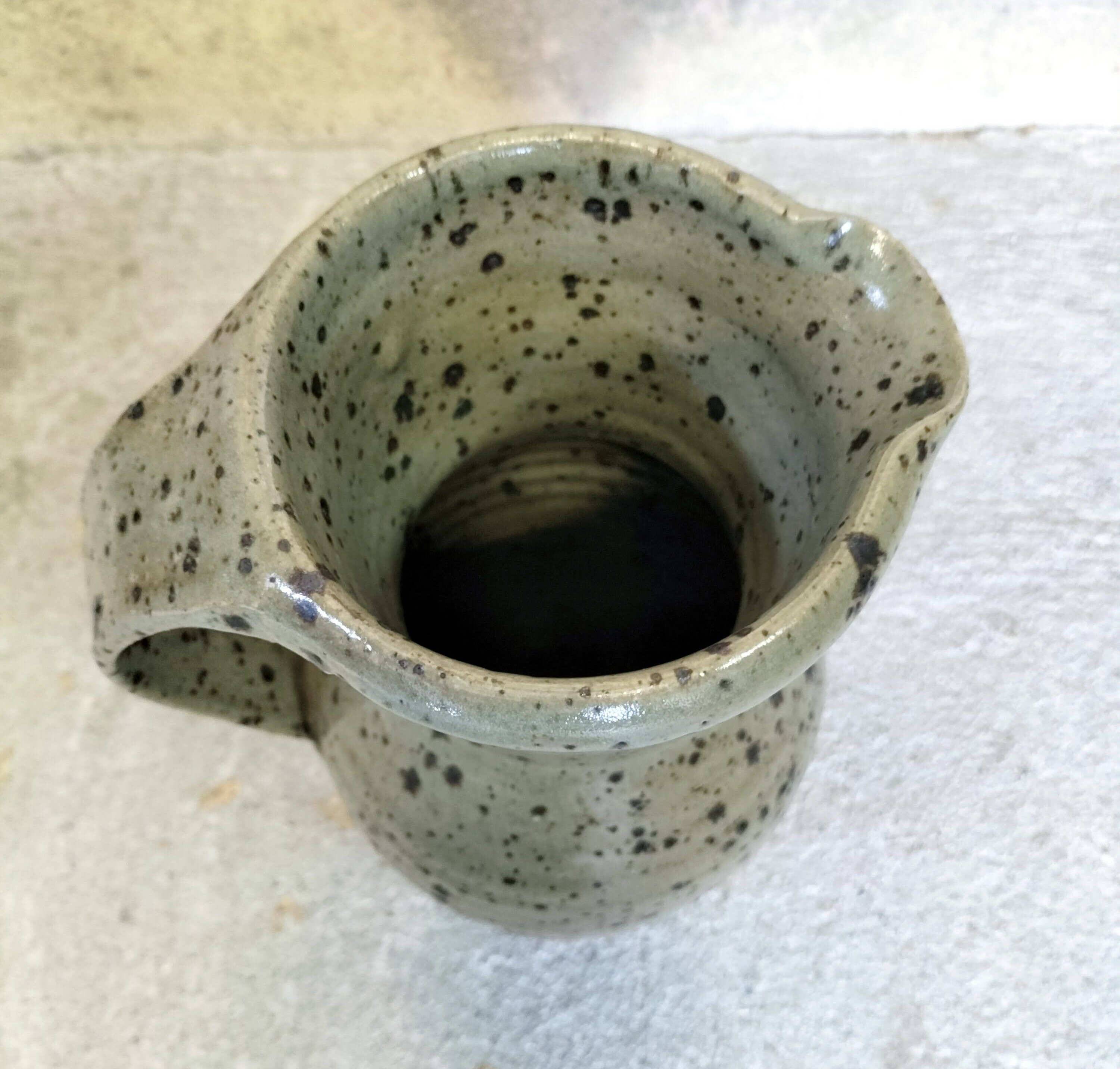 Stoneware pitcher by Gustave Tiffoche