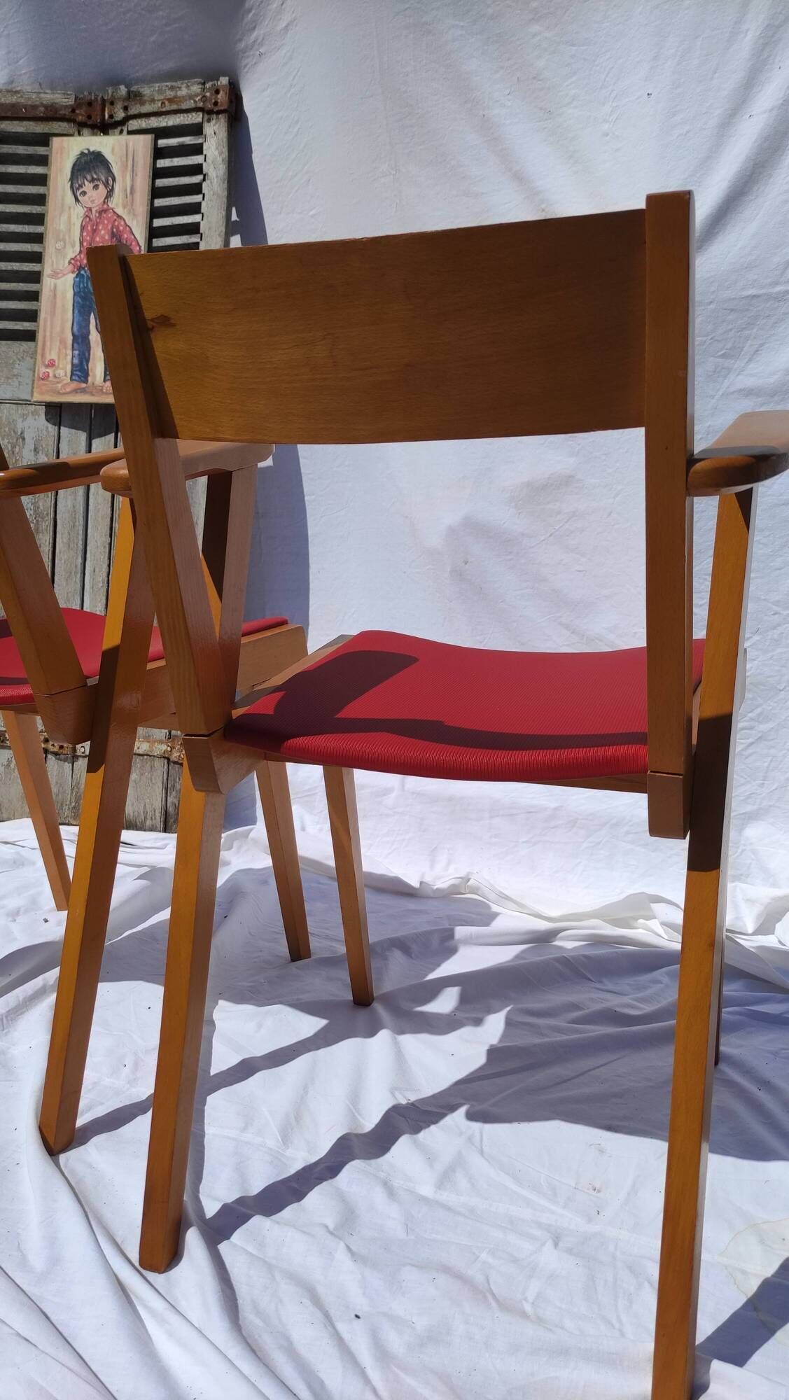 Pair of wooden armchairs and skaï foot compass of the 50s