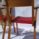 Pair of wooden armchairs and skaï foot compass of the 50s