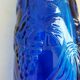 cobalt blue molded glass bottle in relief decoration bunches of grapes