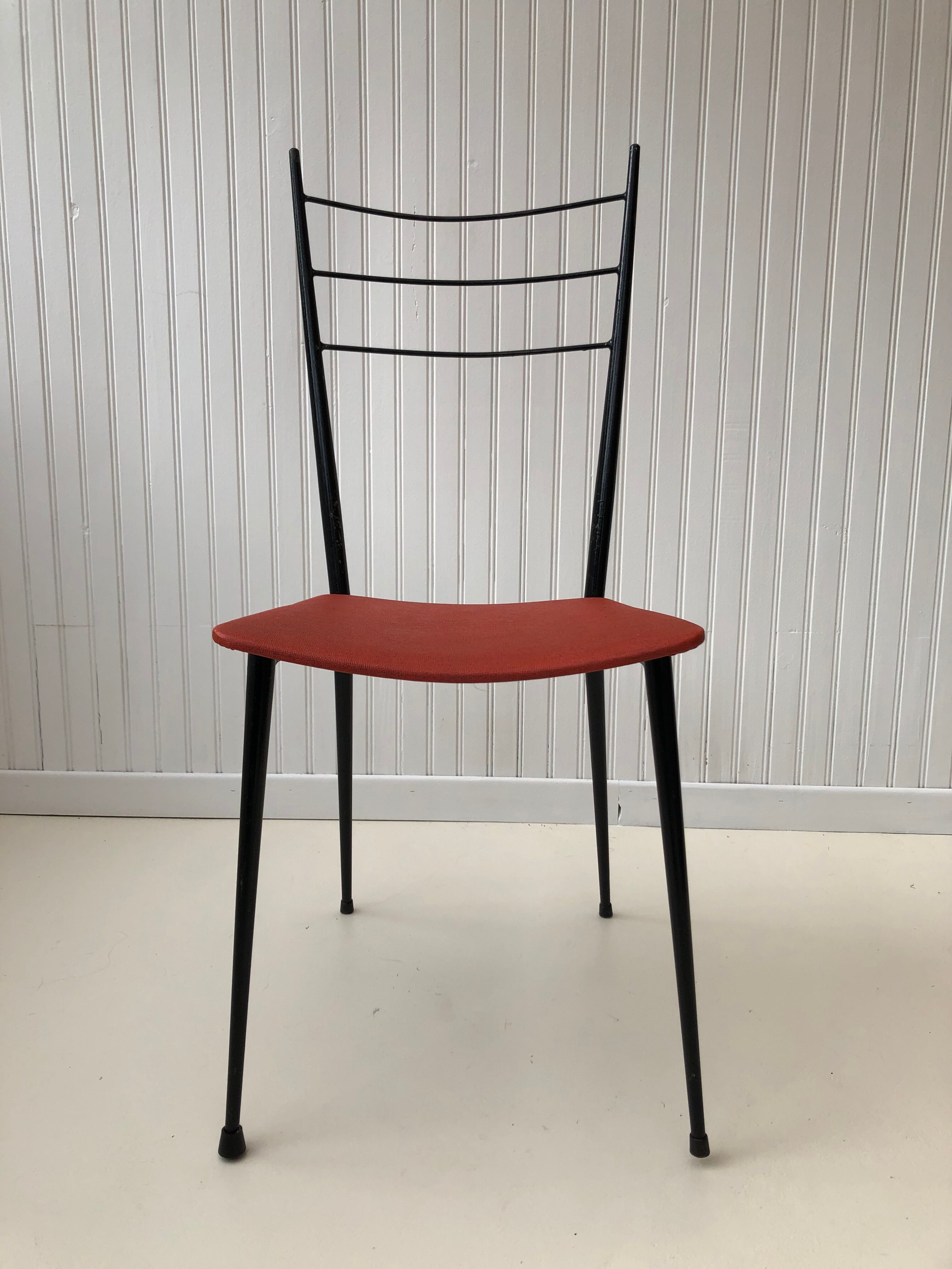 Red metal chairs from the 60s