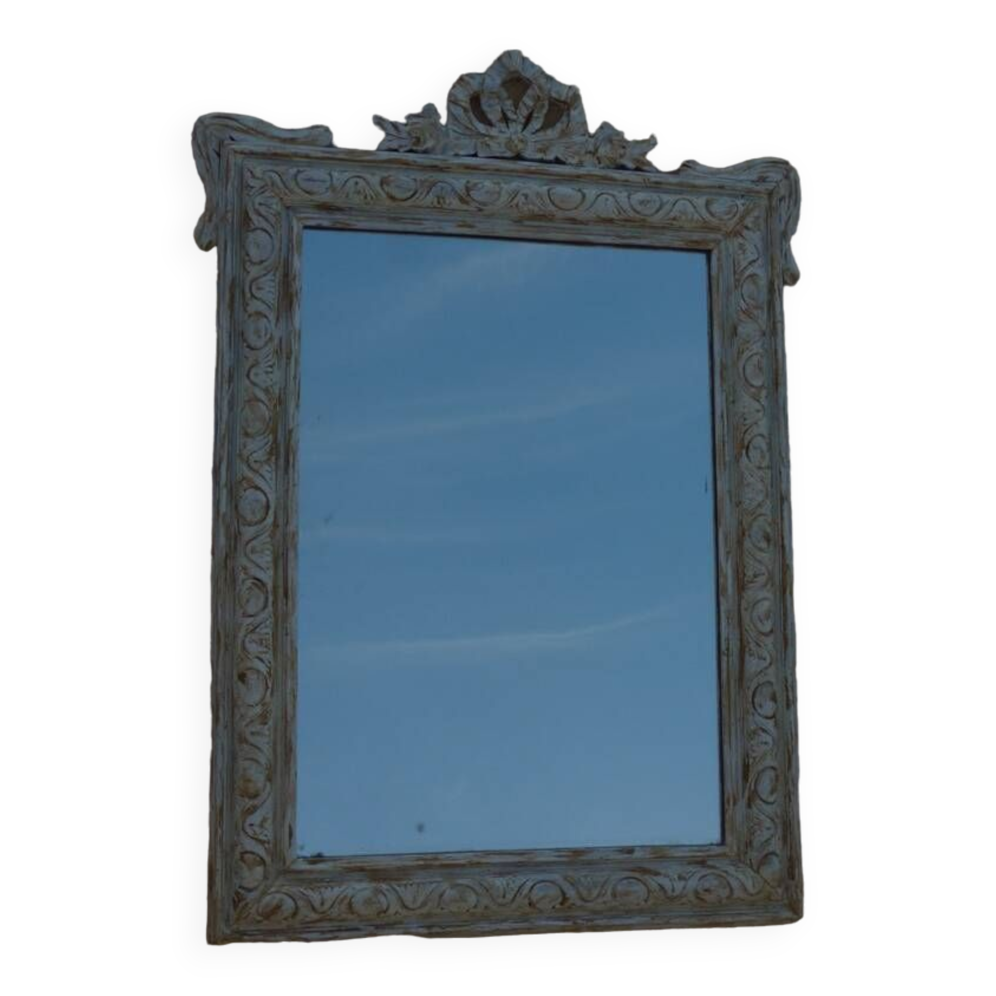 Chic and stylish old mirror with carved wooden frame in limed white and gold