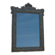 Chic and stylish old mirror with carved wooden frame in limed white and gold