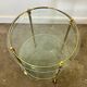 1970s mid-century modern Italian brass and glass round bar cart, Italy.
