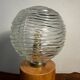 Cylindrical base lamp in solid wood and chiseled glass globe