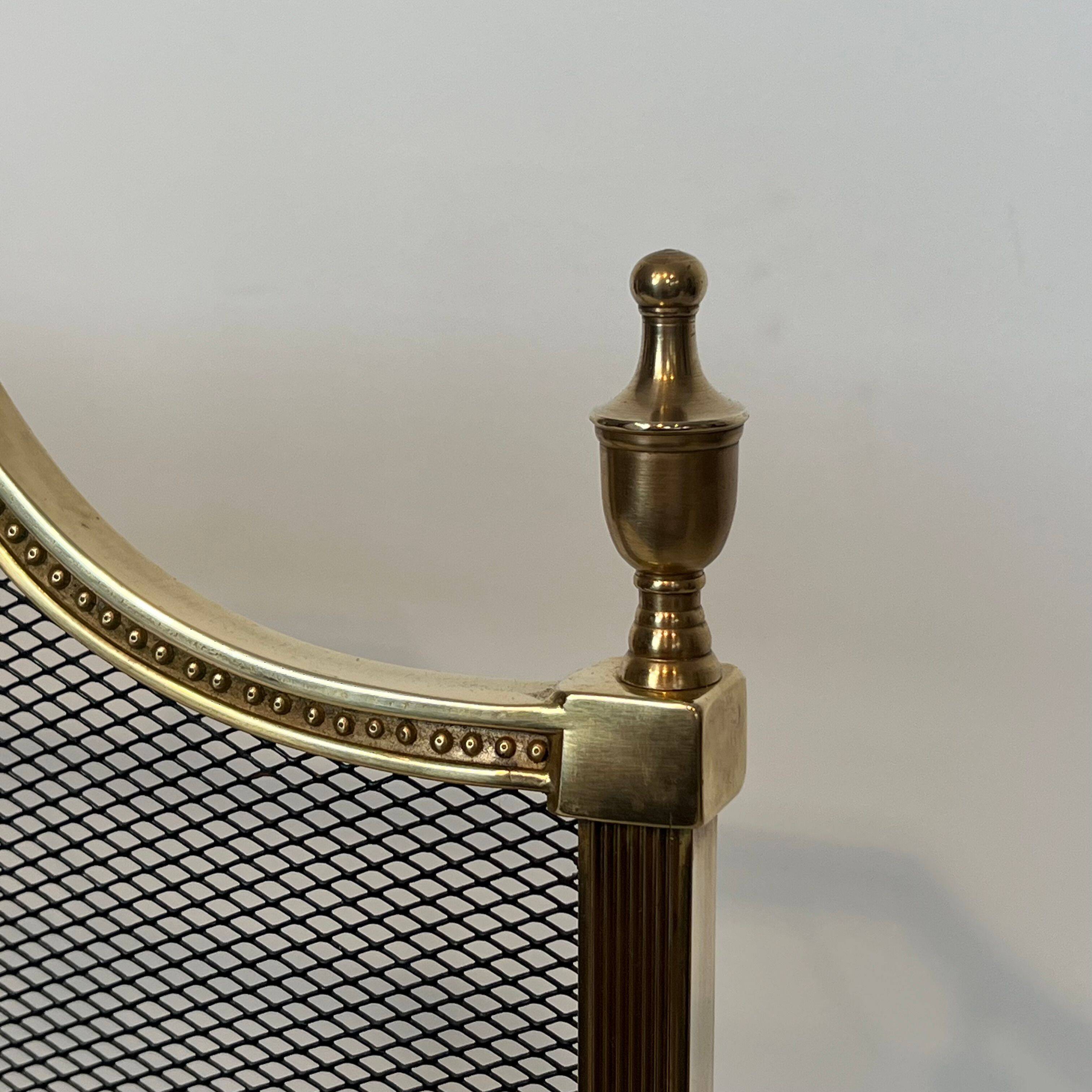 Brass fire screen and grille in the Louis XVI style in the taste of Maison Jansen.