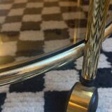 Vintage gold glass table on wheels