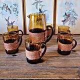 Orangeade set with pitcher and 6 amber glass glasses with "woven" fabric surround