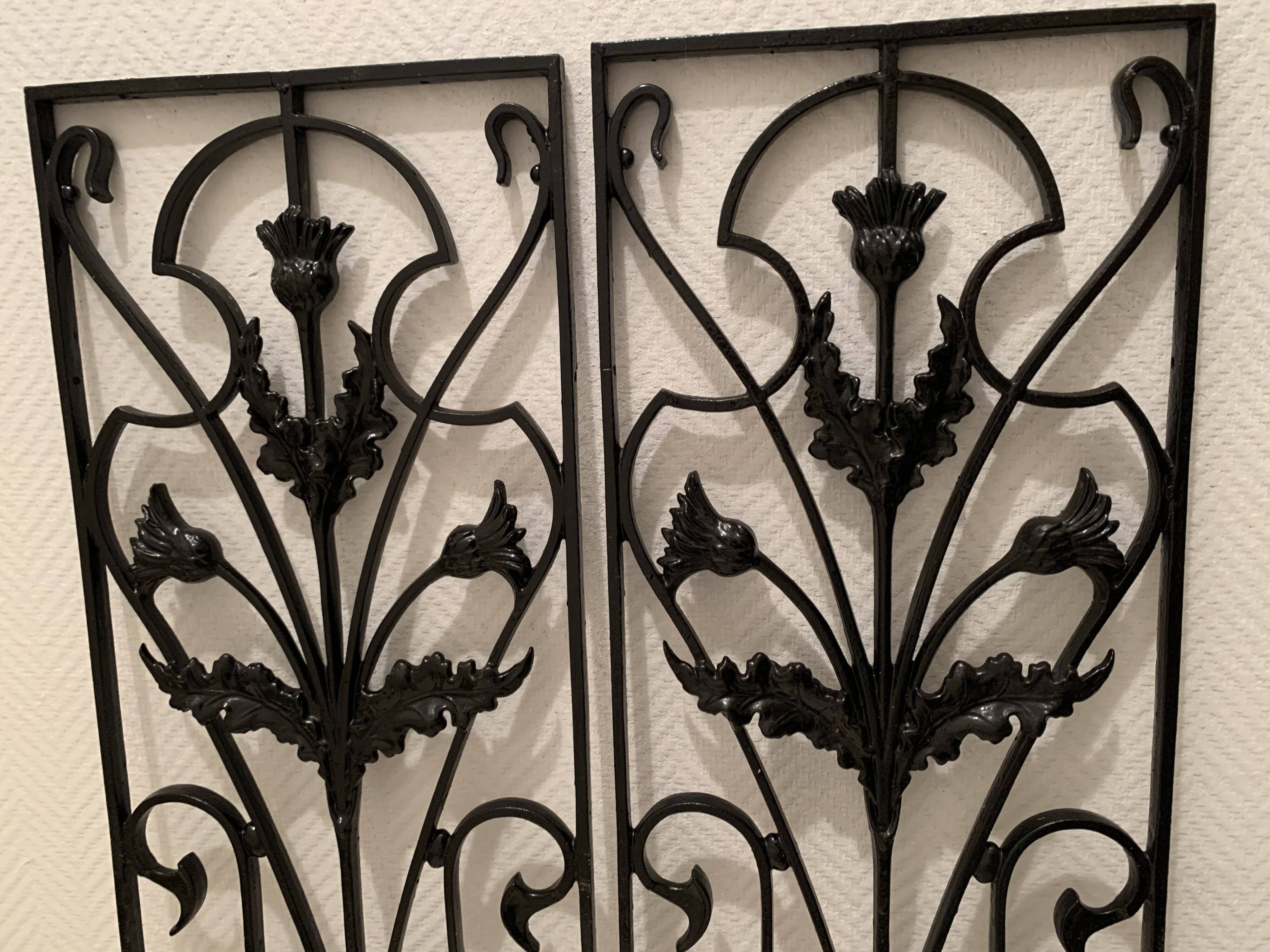 2 Art Nouveau ironwork grids decorated with inopuly or blueberry decoration
