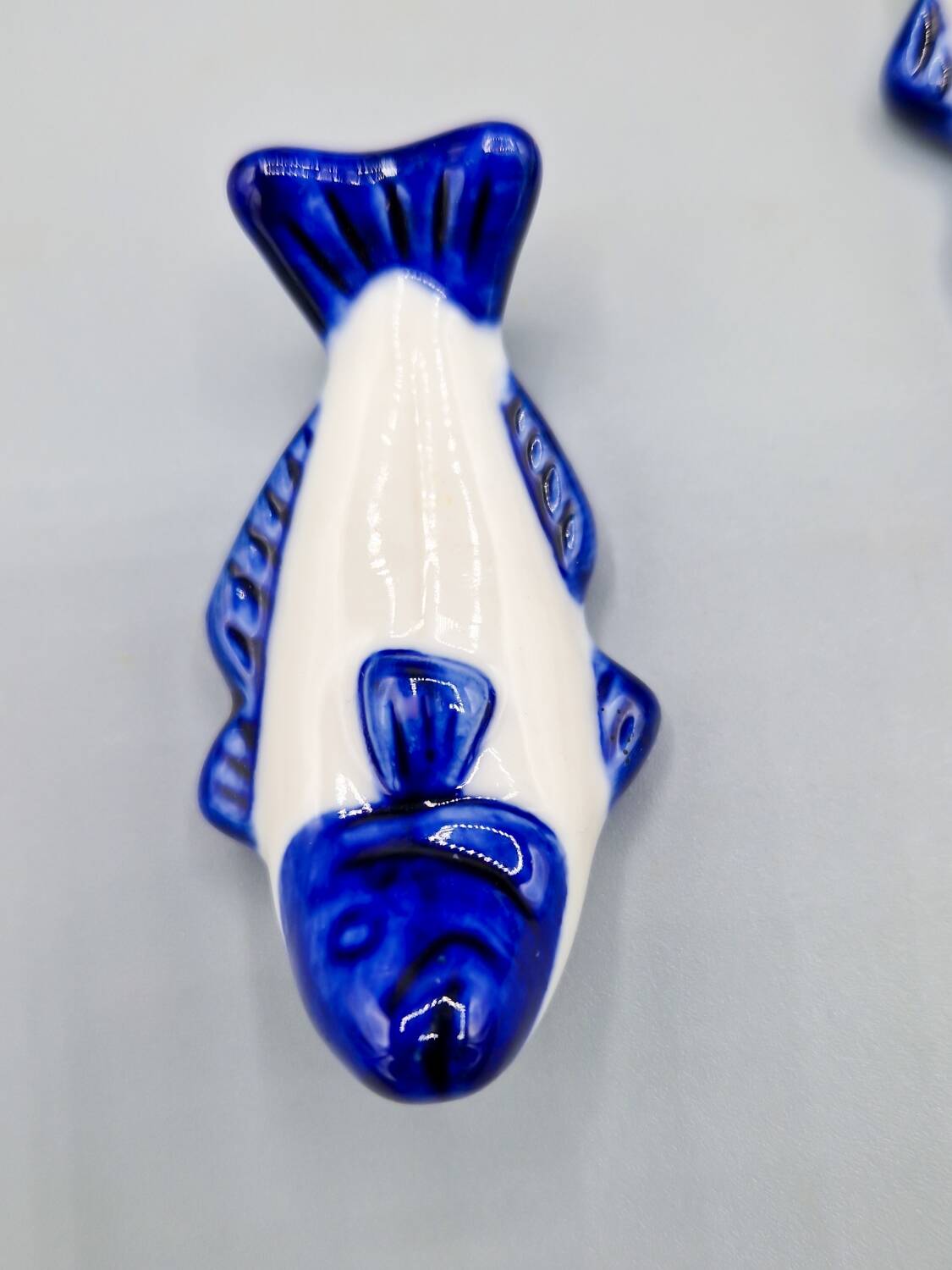 Set of 11 vintage blue and white porcelain fish knife rests.