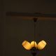 Paavo Tynell for Idman Oy, three-branch chandelier in brass and glass, mid-century, 1940s.