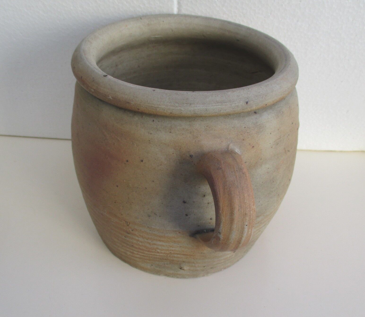 Ancient sandstone pot at one handle
