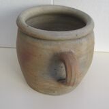 Ancient sandstone pot at one handle