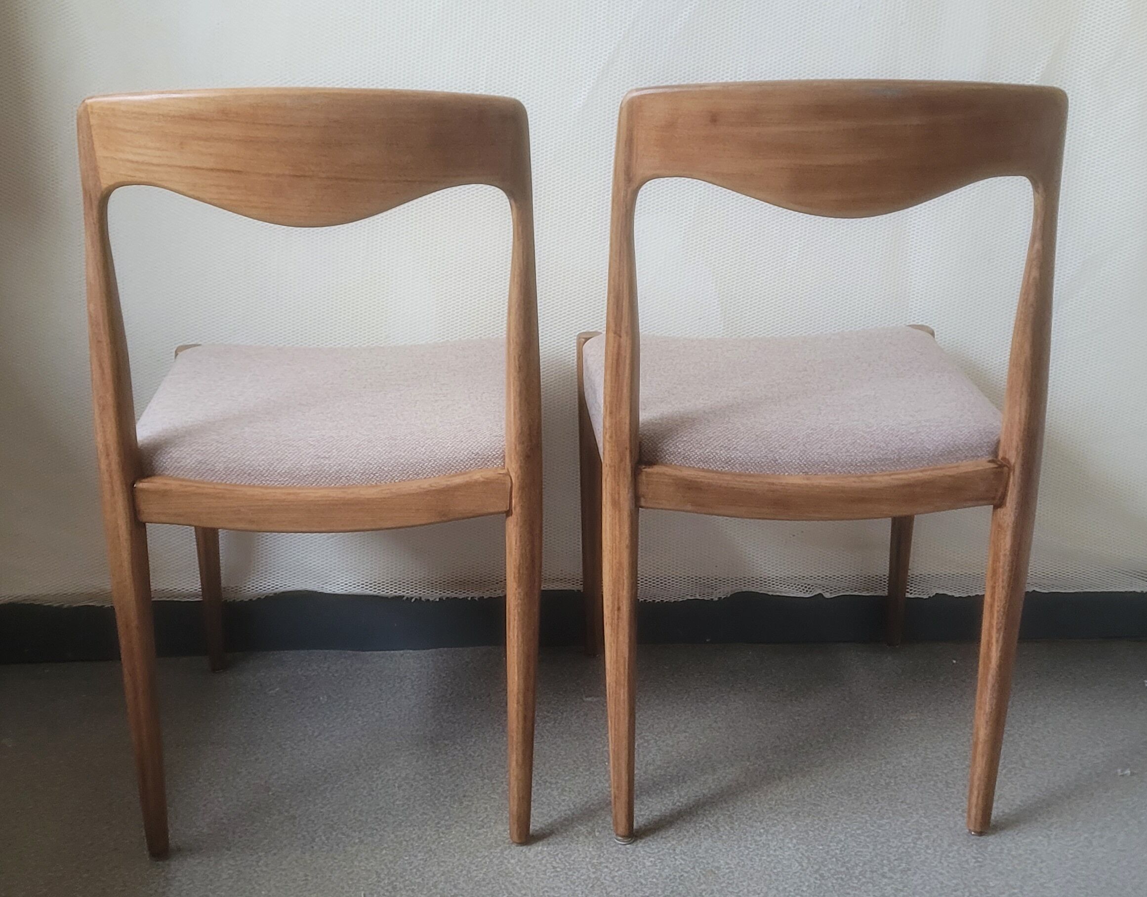 Pair of Scandinavian teak chairs sitting beige gray fabric