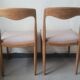 Pair of Scandinavian teak chairs sitting beige gray fabric