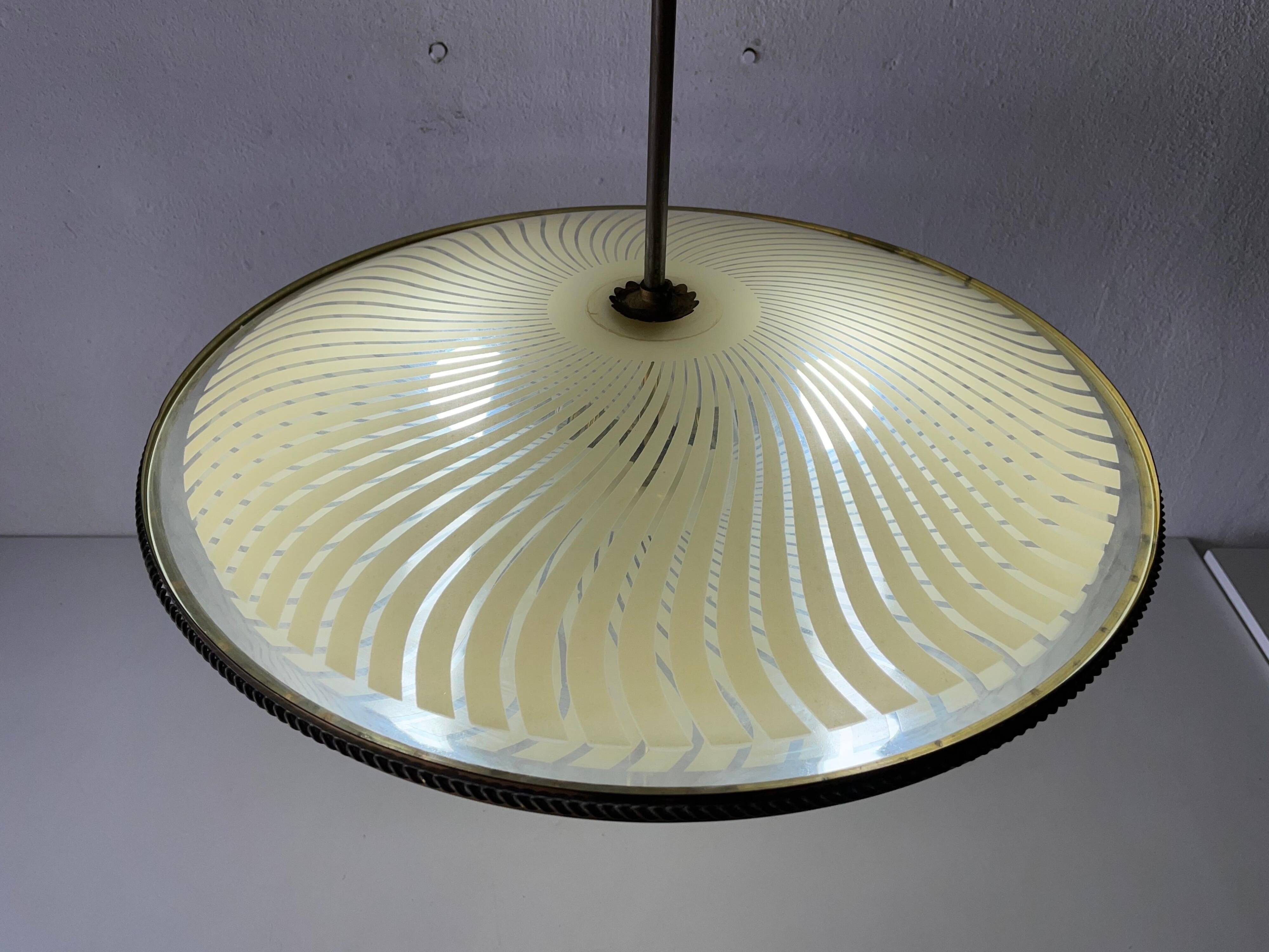 Large UFO design ceiling light in brass and printed glass, 1950s, Italy.