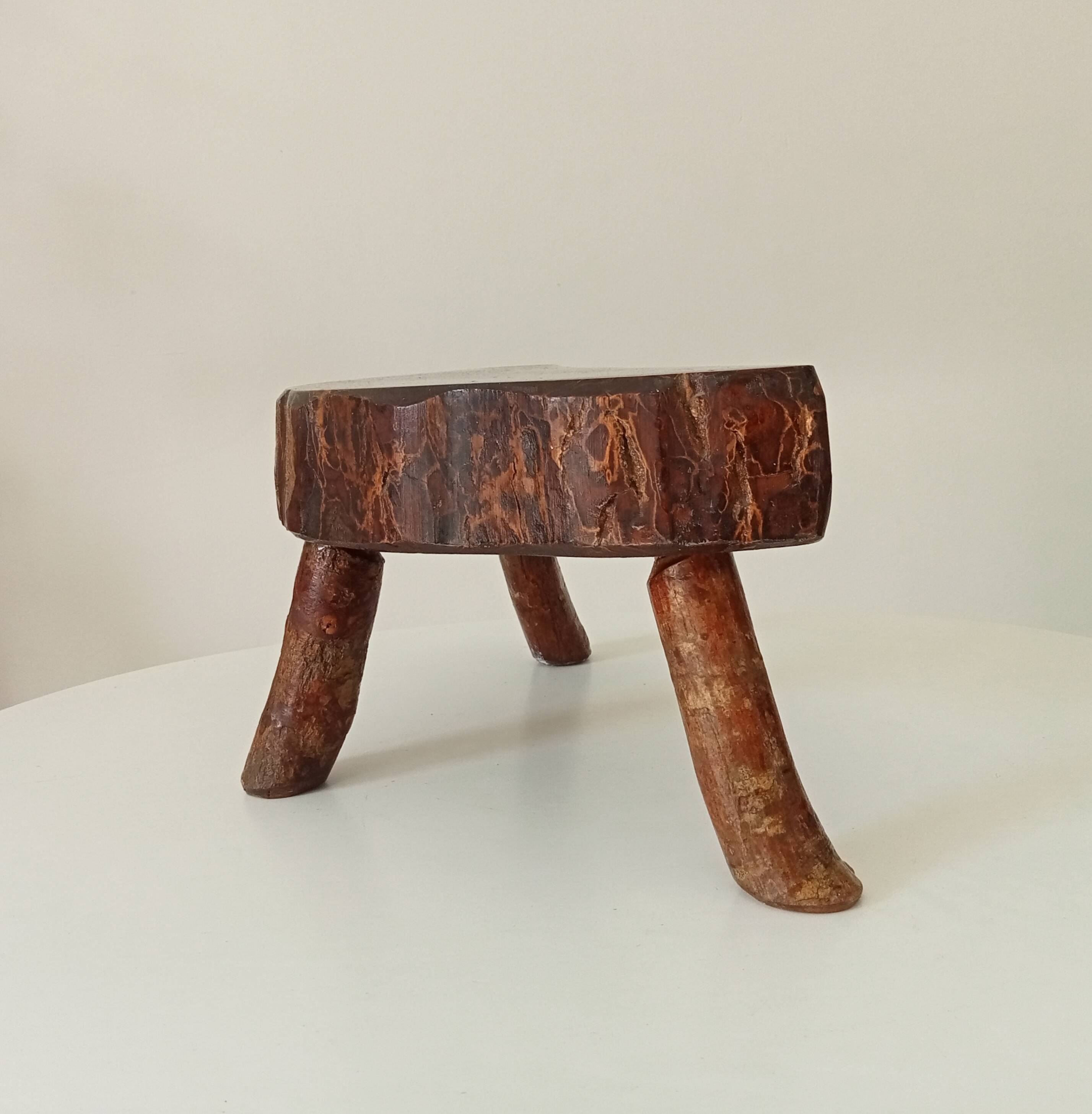 Vintage brutalist tripod stool in solid olive wood
