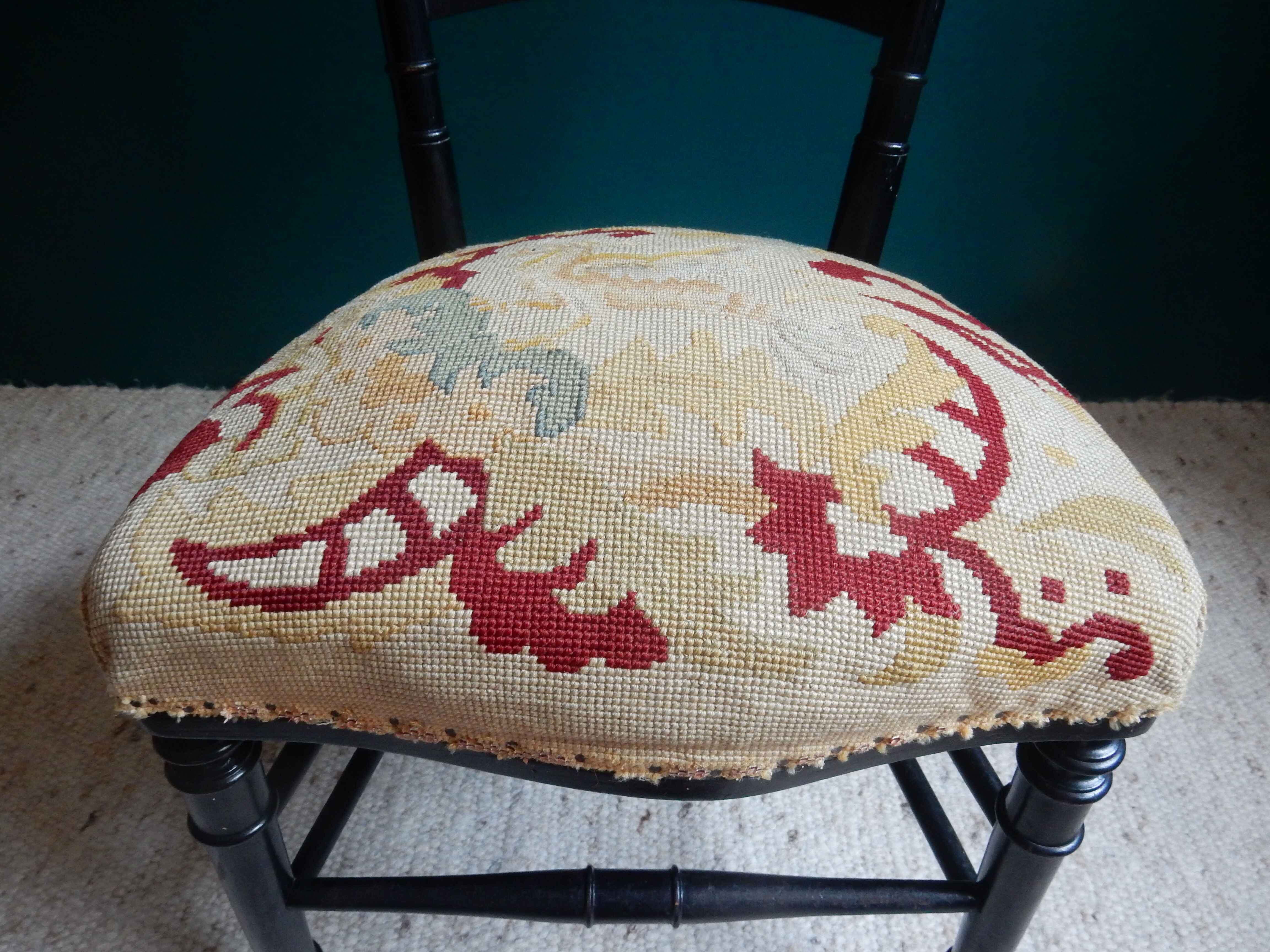 Black Napoleon III chair lined with phoenix