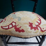 Black Napoleon III chair lined with phoenix