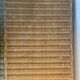 rattan chest of drawers with green details