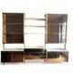 Wall-mounted and modular bookcase in lacquered brass, mirrors and smoked glass by Mahey, Design 1970