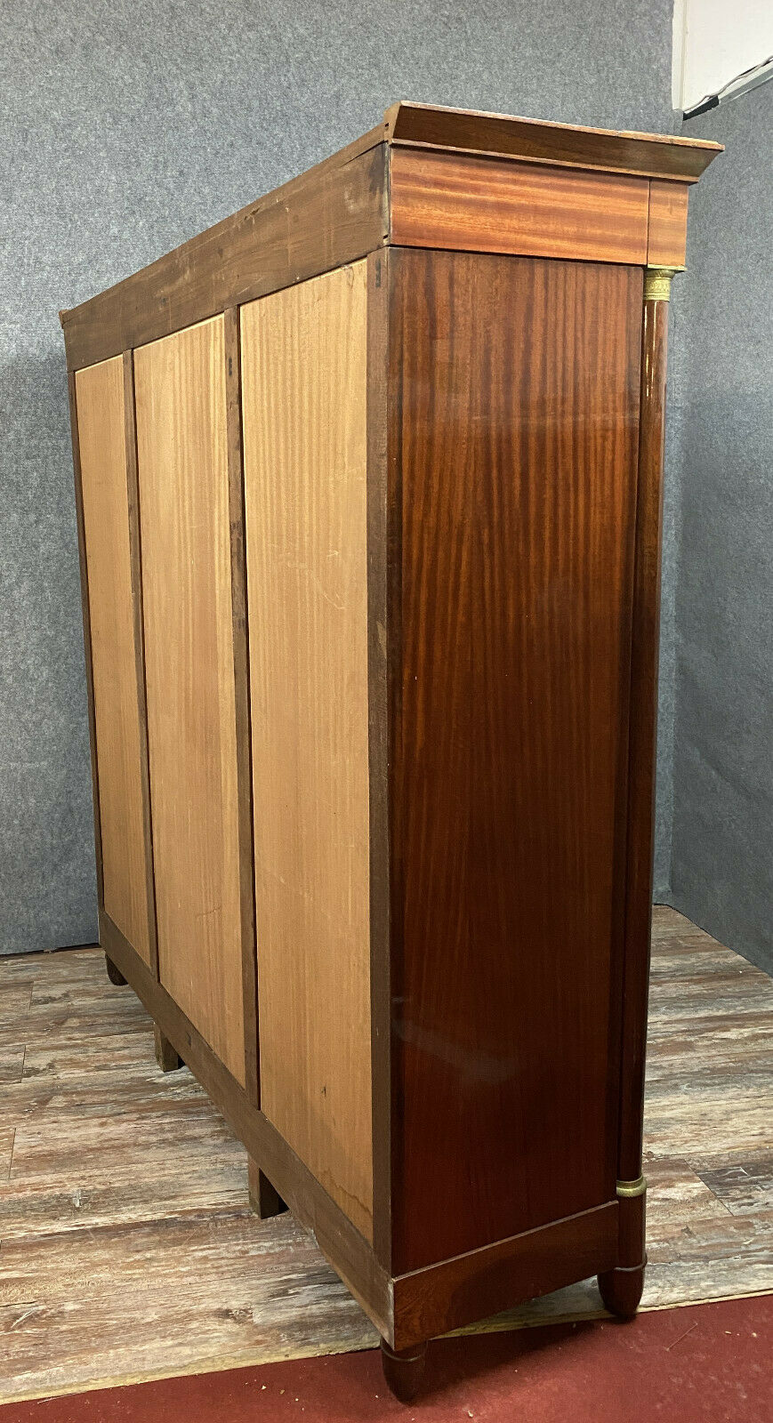 Empire library in varnished mahogany around 1950