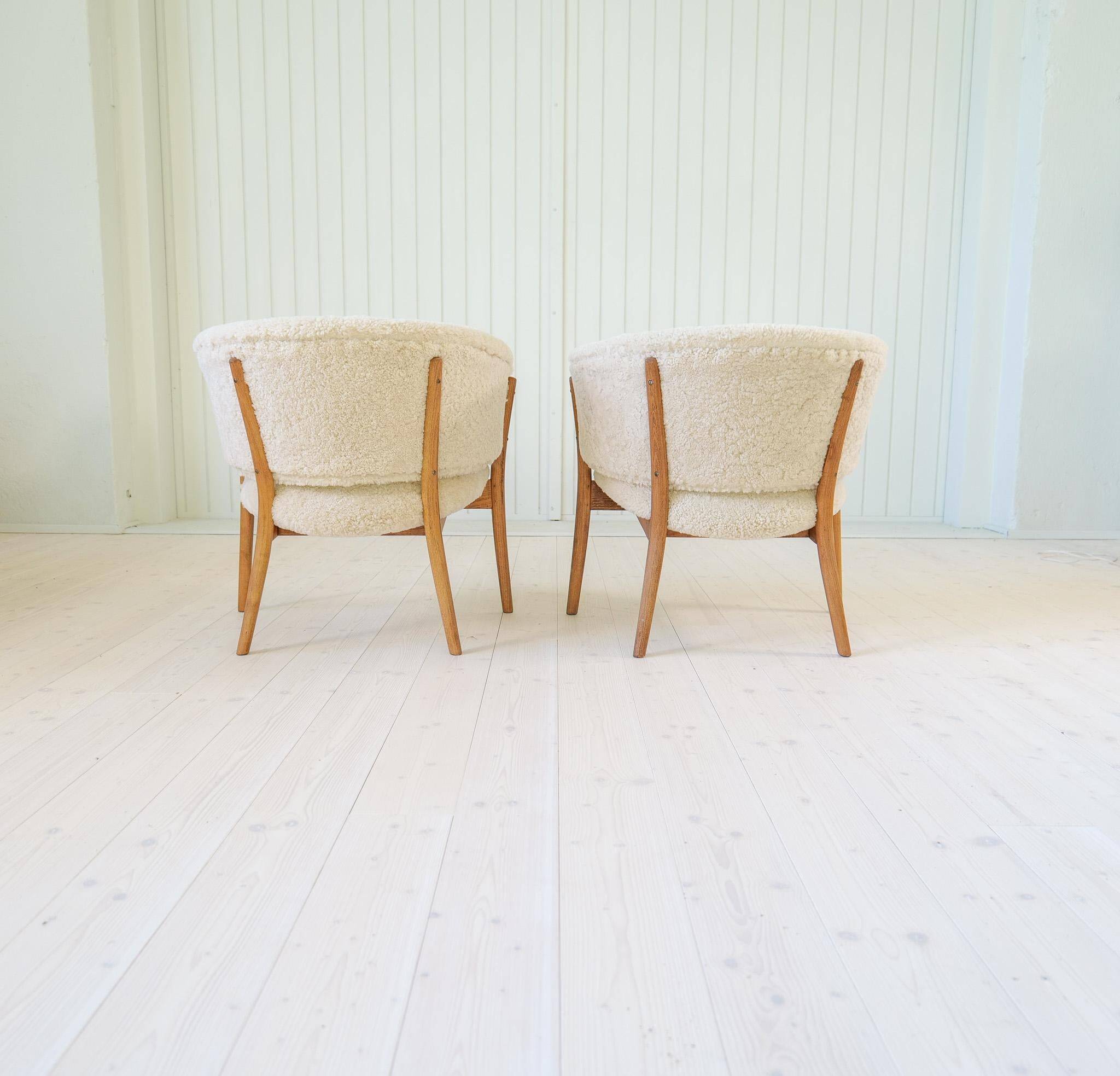 Mid-century lounge chairs in sheepskin/shearling and stained wood, Sweden, 1962.