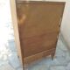 Vintage chest of drawers in raw wood.