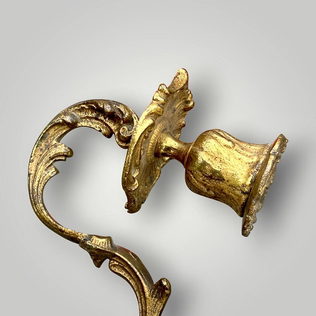 Antique bronze wall sconce with two candlesticks and beveled mirror