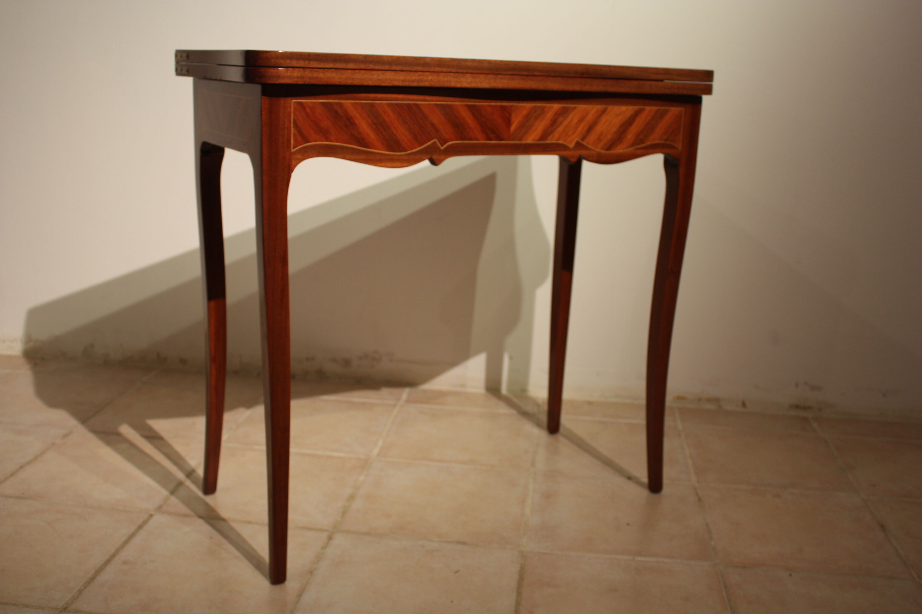 Mahogany game table in the Louis XV style