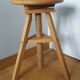 Tripod stool with a screw.