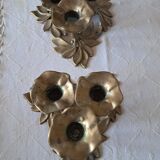 An antique pair of candlesticks with a floral design.