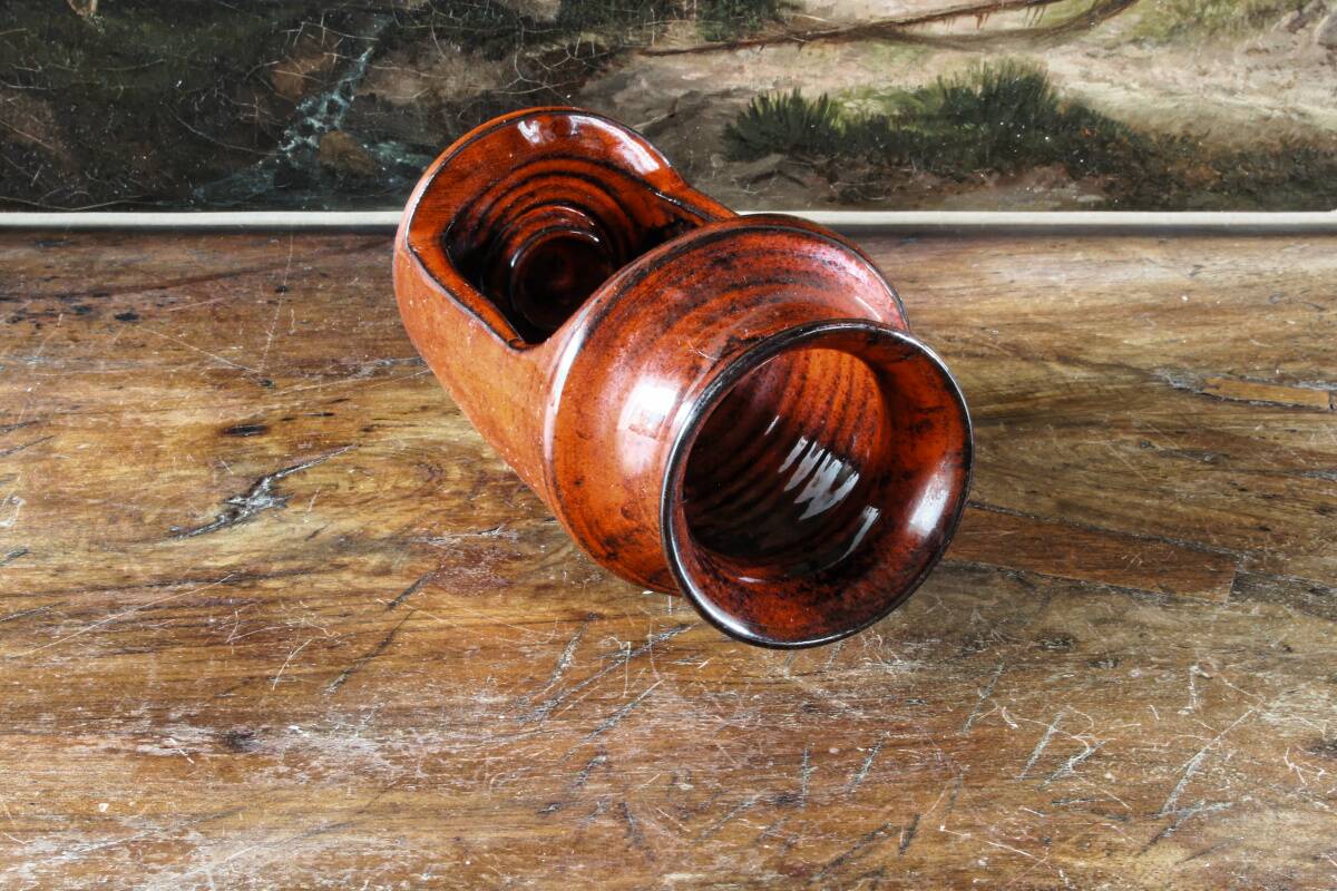 Signed orange ceramic candle holder and jug