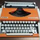 Olympia traveler de luxe orange typewriter serviced and new ribbon