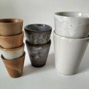 Set of 8 stoneware cups and a mug, shades of beige.